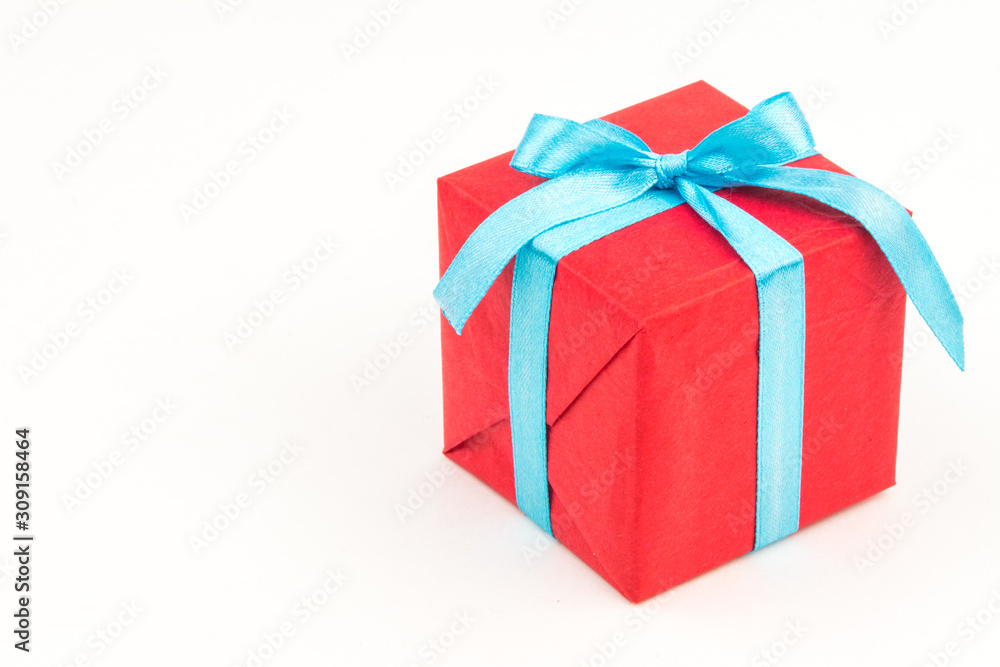 Gift box with ribbons and christmas decor isolated on white background. Happy birthday colorful gift Gift box with ribbons and christmas decor isolated on white background. Happy birthday colorful gift