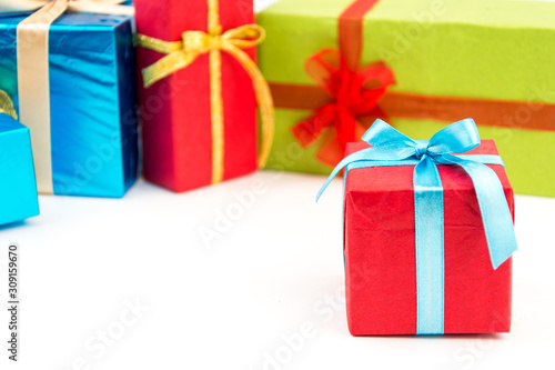 Gift boxes with ribbons and christmas decor isolated on white background. Happy birthday colorful gifts