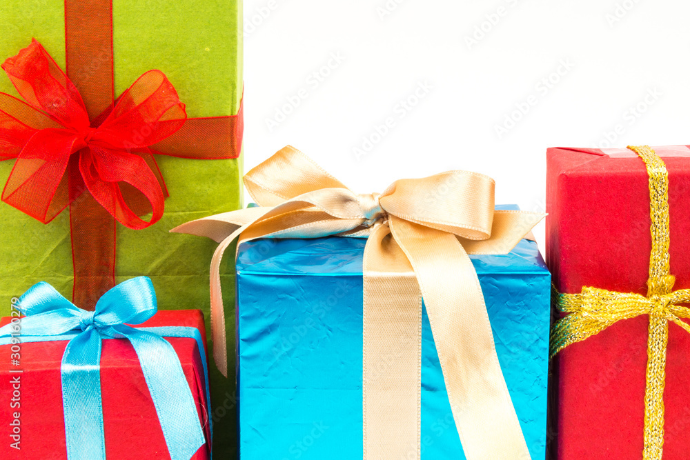 Gift boxes with ribbons and christmas decor isolated on white background. Happy birthday colorful gifts Gift boxes with ribbons and christmas decor isolated on white background. Happy birthday colorful gifts