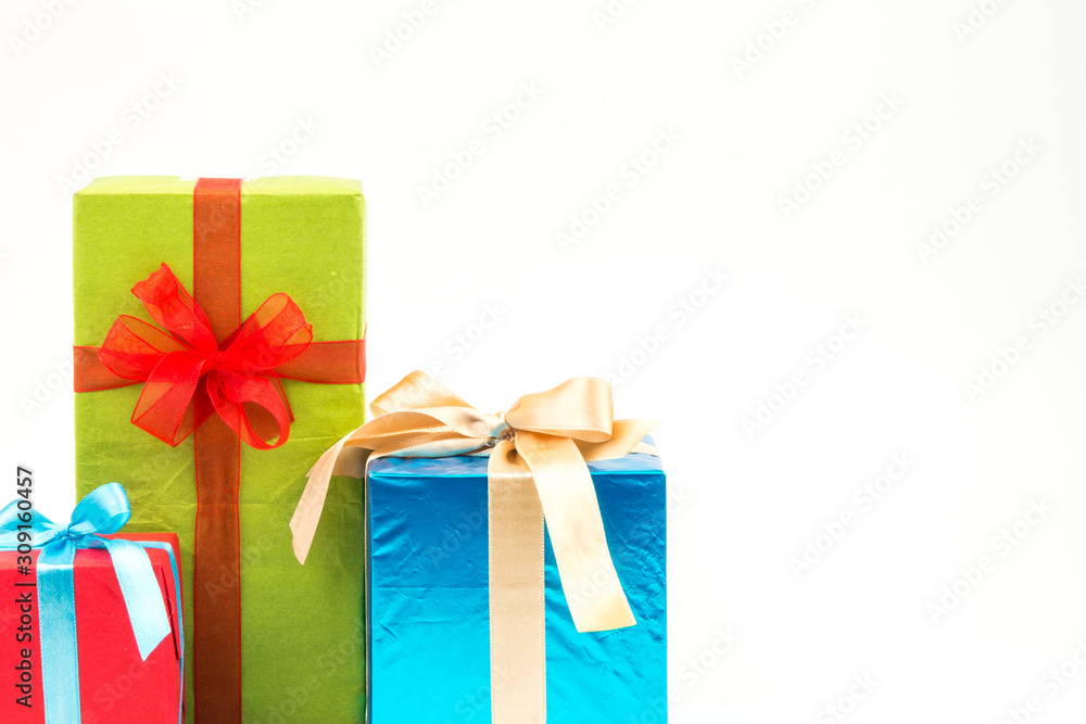 Fototapeta premium Gift boxes with ribbons and christmas decor isolated on white background. Happy birthday colorful gifts