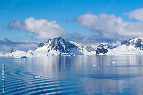 Snow-capped mountains on an island along the coasts of the Antarctic Peninsula, Palmer Archipelago, Antarctica