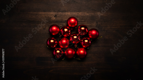 Red Christmas tree balls on wooden table
