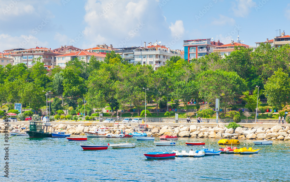 Colorful pleasure and fishing boats are moored in Avcilar