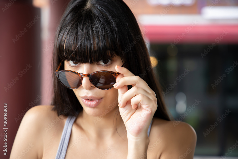 portrait of excited, happy, surprised Brazilian woman with exciting wow, oh, aw face expression; south American, latin American woman model portrait of excited, happy, surprised Brazilian woman with exciting wow, oh, aw face expression; south American, latin American woman model