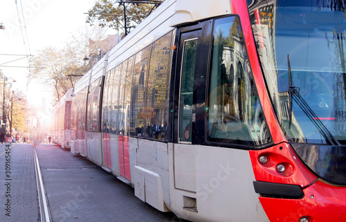 tram rides on the rails of the street of the old city