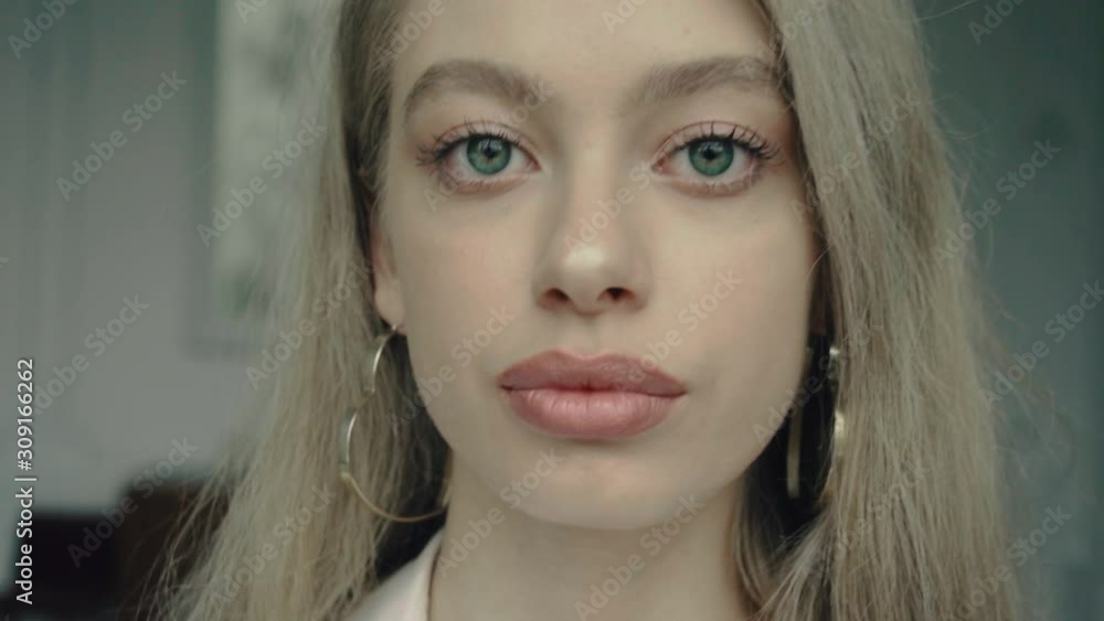 Close-up Portrait of Confident Elegant Girl in Slow-Motion. Close-up Portrait of Confident Elegant Girl in Slow-Motion.