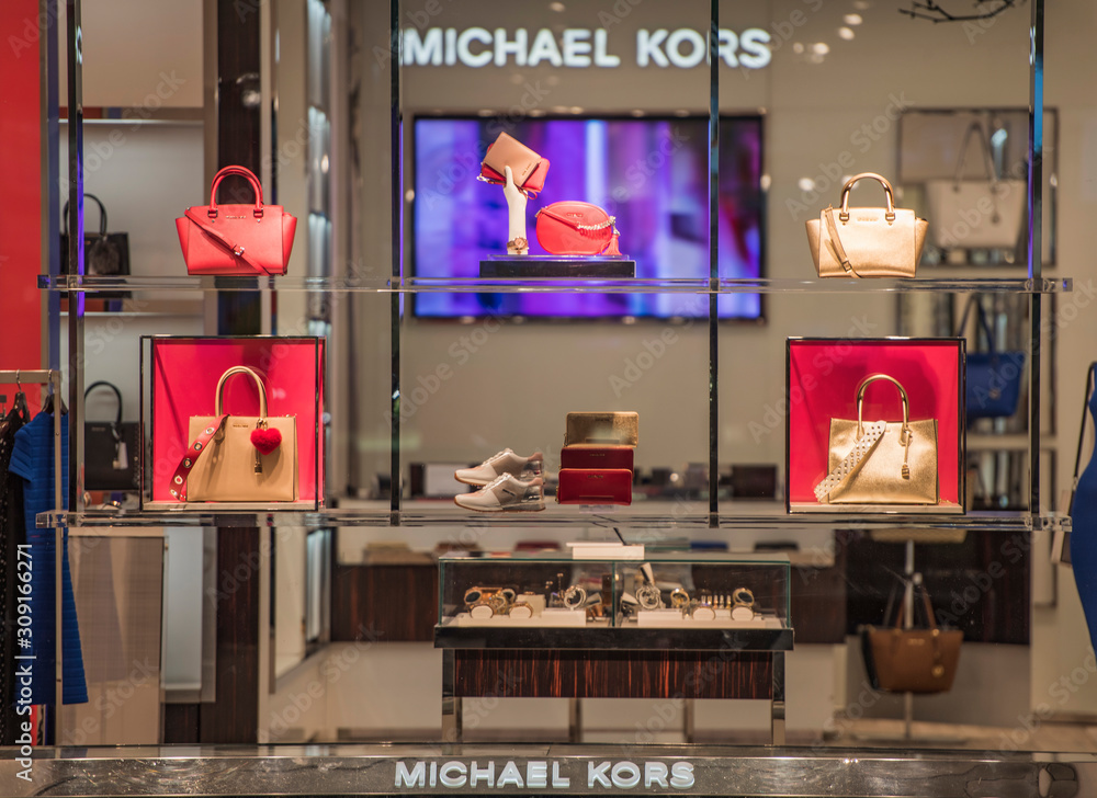 London, England - February 18, 2017: Michael Kors luxury handbag in a store  in central London. Stock Photo | Adobe Stock
