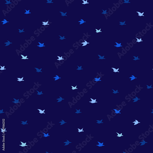 Small swallow Birds Summer Print. Seamless Pattern with Simple Birds Silhouettes. Classic Blue Concept. Color of the year 2020. Elegant flying crabe birds wings on blue background © ilonitta