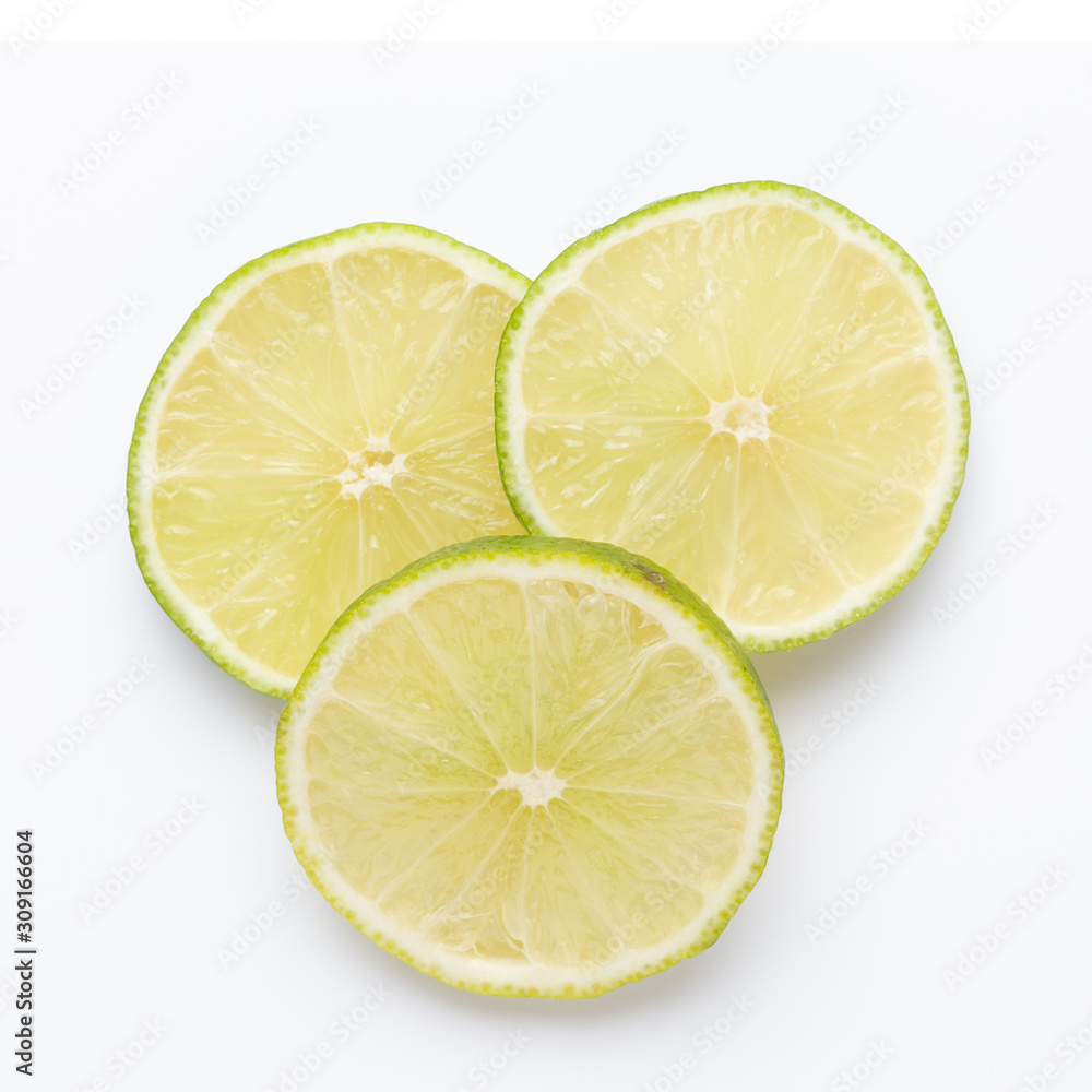 Composition with fresh ripe limes on light background, top view