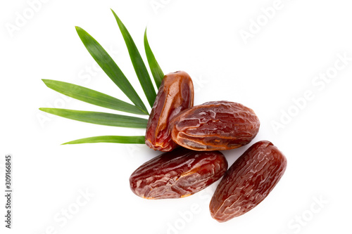 Dry dates isolated on white background. Top view. Flat lay pattern. photo