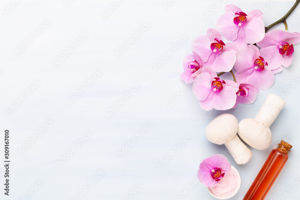 Sea salt, aromatherapy oil in bottles and orchid on vintage wooden background. Sea salt, aromatherapy oil in bottles and orchid on vintage wooden background.