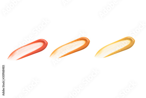 Smears of foundation for face. Cosmetic isolated liquid on white background