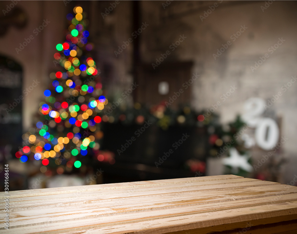 Empty table in front of christmas tree with decorations background. For product display montage. Empty table in front of christmas tree with decorations background. For product display montage.