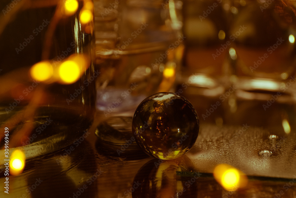 Christmas glass balls on the background color of whiskey Christmas glass balls on the background color of whiskey