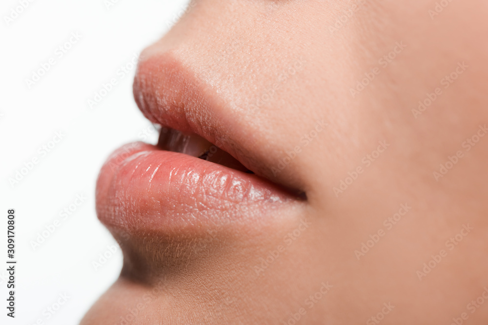 close up of young woman with shiny lip gloss on lips close up of young woman with shiny lip gloss on lips