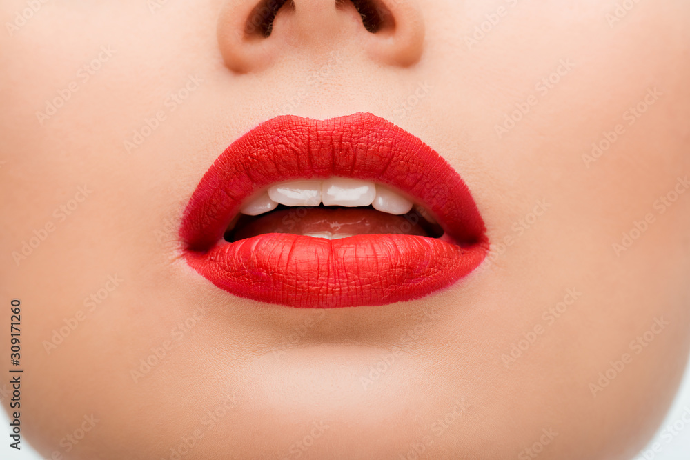 Fototapeta premium cropped view of young woman with red lipstick