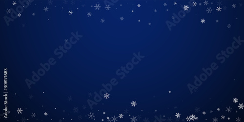Sparse snowfall Christmas background. Subtle flyin