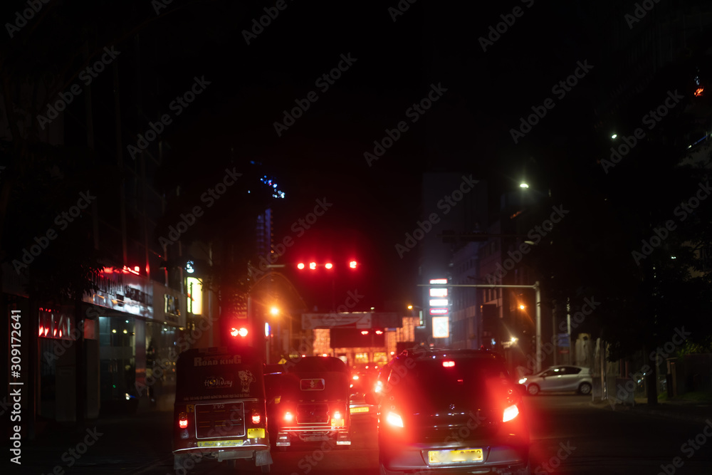 Fototapeta premium Night road in the city of lights cars traffic jams