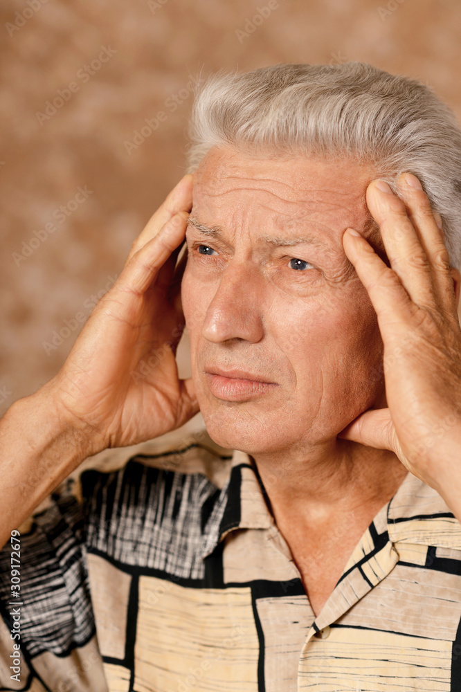 Close-up portrait of sad sick senior man with headache Close-up portrait of sad sick senior man with headache