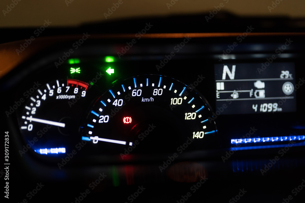 Modern car illuminated dashboard closeup Modern car illuminated dashboard closeup