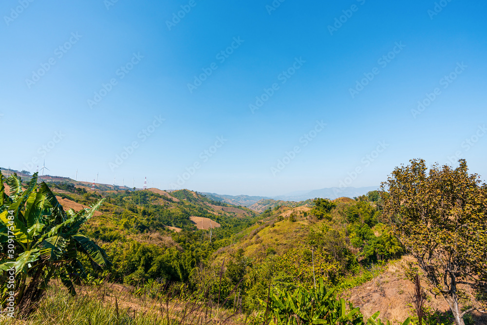 beautiful blue sky high peak mountains mist fog wildlife green forest at Khao Koh Phu Tub Berk Phetchabun Thailand guiding idea long weekend for backpacker camping campfire relaxing hiking  