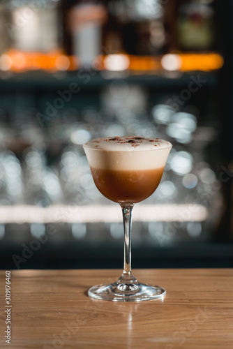 Espresso vodka cocktail on a bar desk.