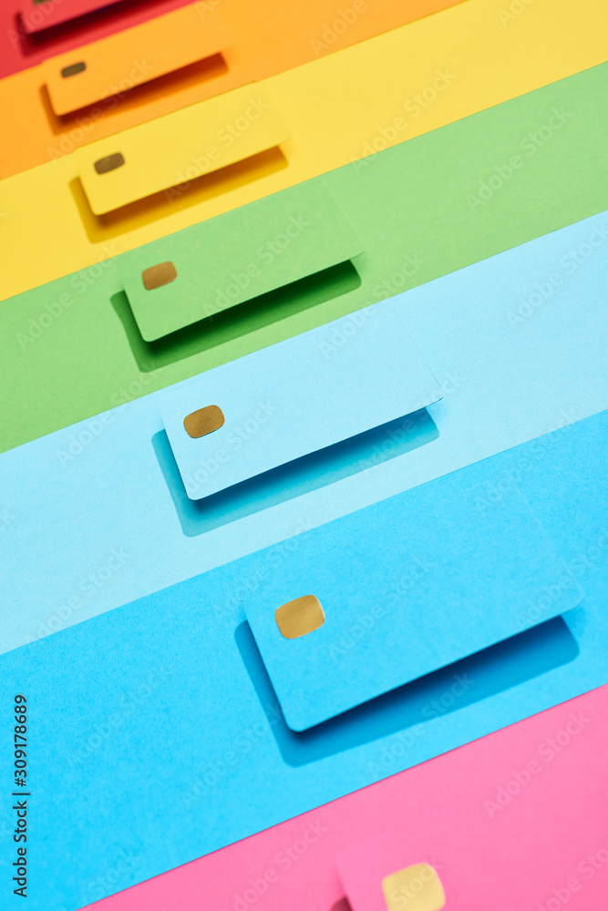 multicolored empty credit cards on rainbow background multicolored empty credit cards on rainbow background