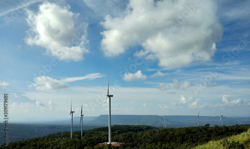 Wind turbine farm on the hill with clouds sky background, Lam Takhong Reservoir, Nakhonratchasima, Thailand