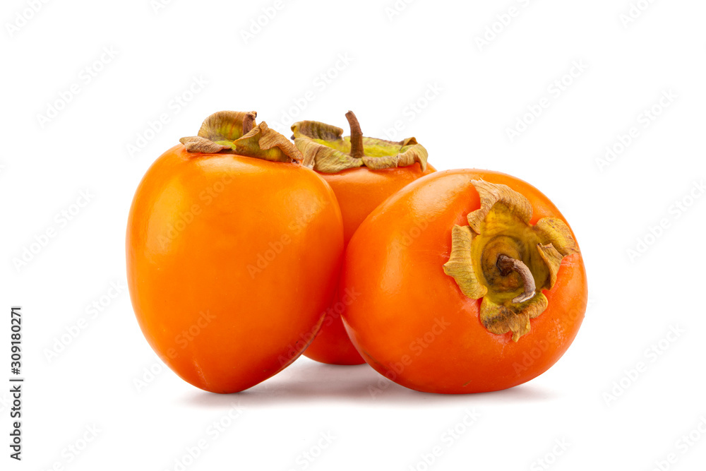 fresh ripe persimmons with leaf isolated on white background. full depth of field fresh ripe persimmons with leaf isolated on white background. full depth of field