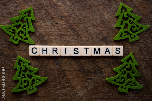 the word Christmas on wood