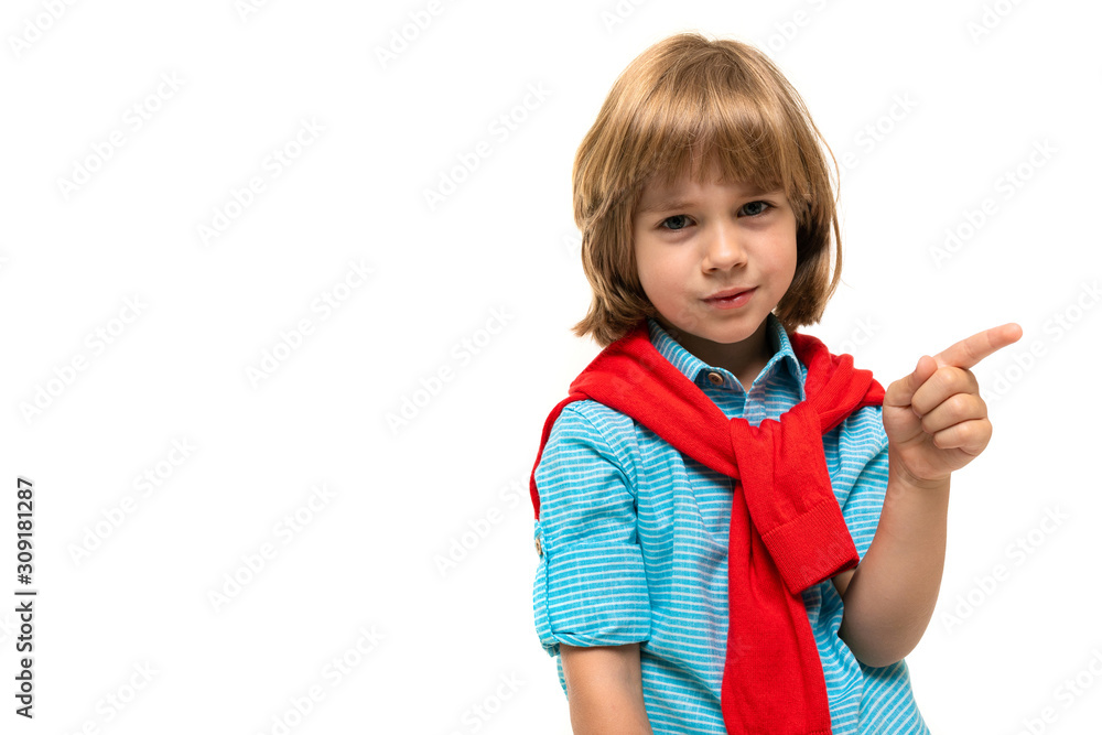 Sports teenager boy in t-shirt with hoody around his neck gesticulates isolated on blue background Sports teenager boy in t-shirt with hoody around his neck gesticulates isolated on blue background