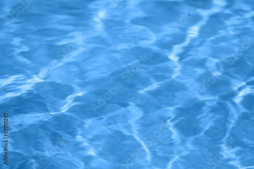 Classic blue sea water surface texture. Toned color of the year 2020 trendy blue background. Main color trend concept.