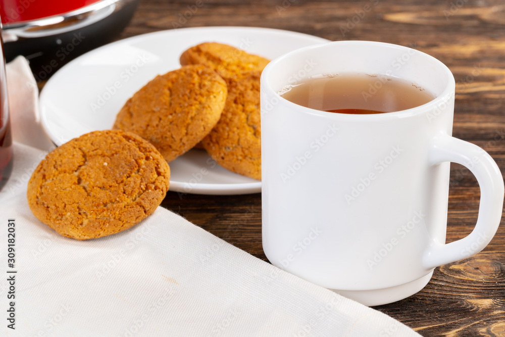 Tea served on a wooden kitchen table Tea served on a wooden kitchen table