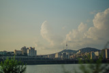 Seoul tower and Namsan under the clump clouds from the Han River on afternoon of summer