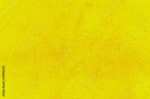 Fondo amarillo de una pared con manchas.