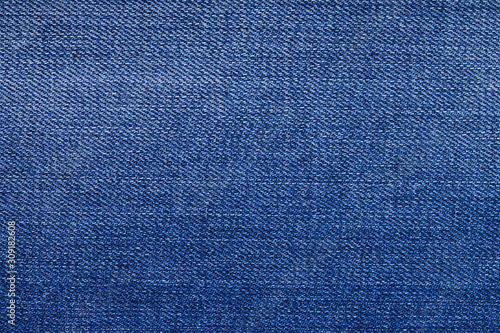 Top view of blue denim jeans, denim background with gradient