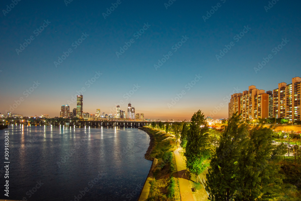 Fototapeta premium Cityscape with sky scrappers after sunset. 
