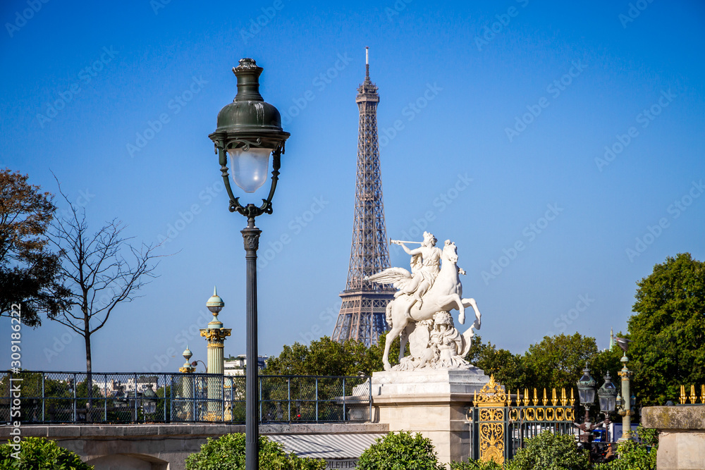 Marble statue and Eiffel Tower view from the Tuileries Garden, Paris