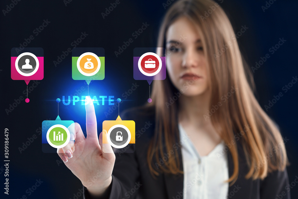 Business, Technology, Internet and network concept. Young businessman working on a virtual screen of the future and sees the inscription: Update Business, Technology, Internet and network concept. Young businessman working on a virtual screen of the future and sees the inscription: Update