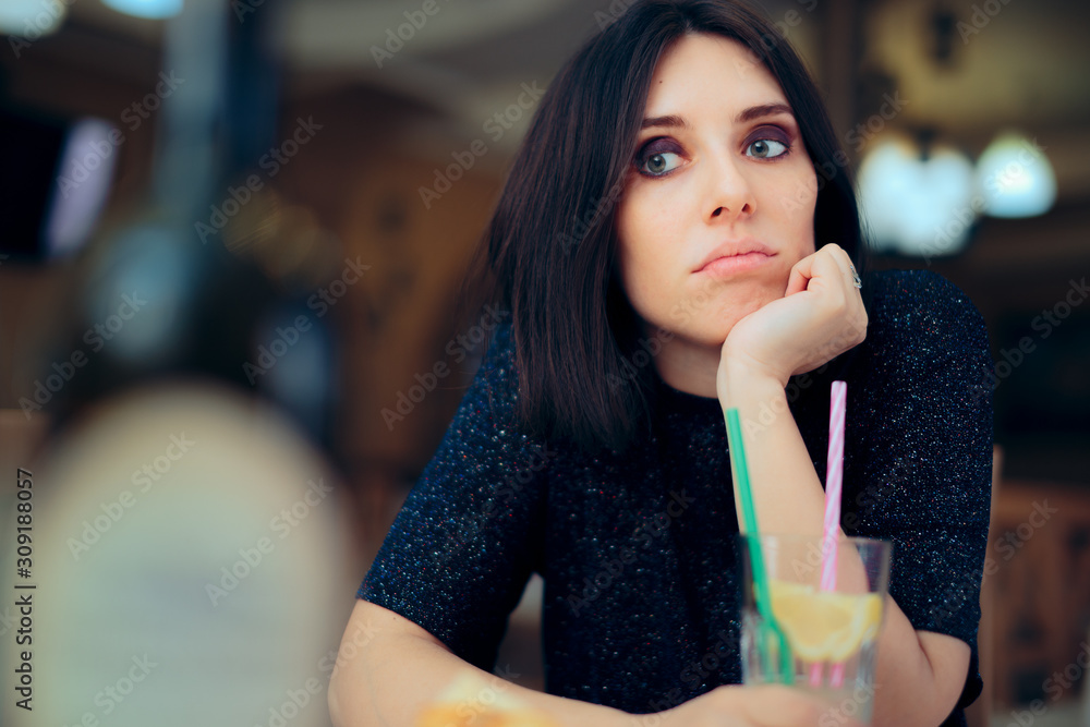 Bored Woman Having a Lemonade at a Party