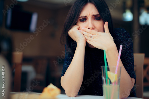 Billede på lærred Nauseated Woman Feeling Sick at the Restaurant