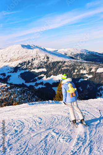 Woman Skier skiing in Penken Park in Tyrol in Austria photo