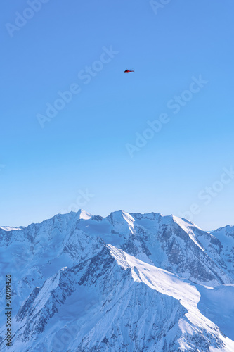 Helicopter flying over Hintertux Glacier of Austria