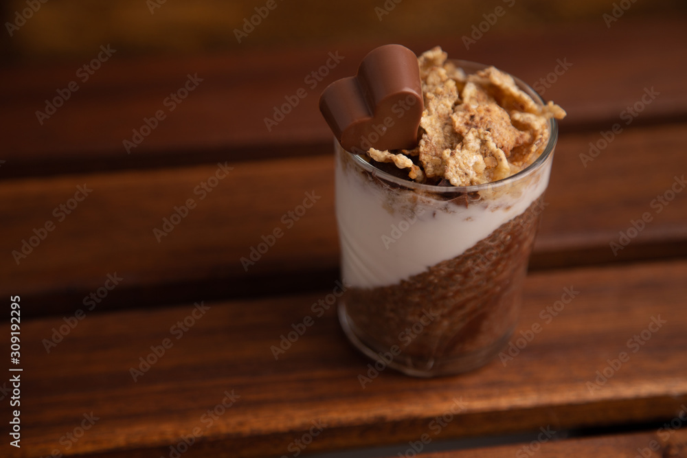 Delicious breakfast, cocoa chia pudding with yogurt and cereals Delicious breakfast, cocoa chia pudding with yogurt and cereals