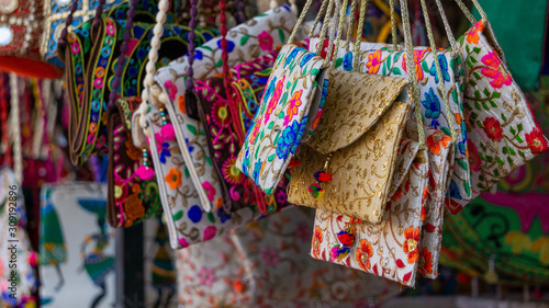 Colorful embroidered ethnic purses for sale in market
