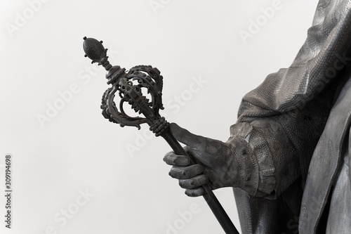 classical statue with hand holding a scepter photo