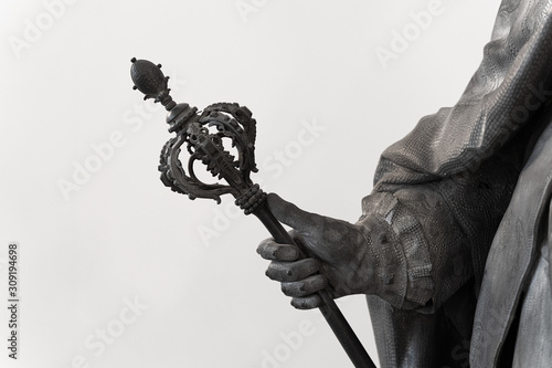 classical statue with hand holding a scepter