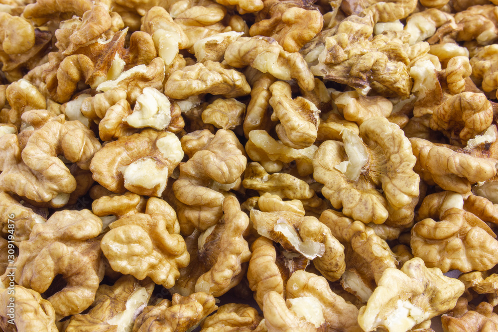 Background texture of walnut kernels. Nut butterflies. Background texture of walnut kernels. Nut butterflies.