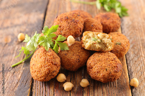 fried falafel with herb on wood background