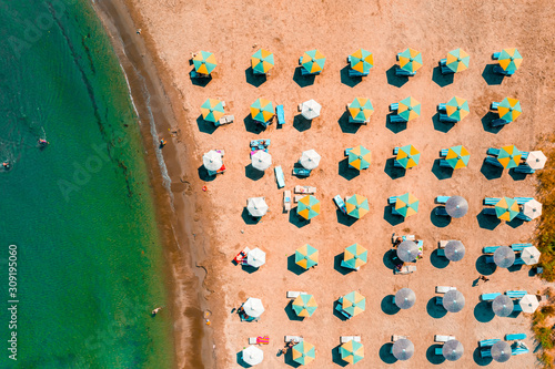 View of umbrellas and people relaxing and bathing at Alaminos beach. Larnaca District, Cyprus photo
